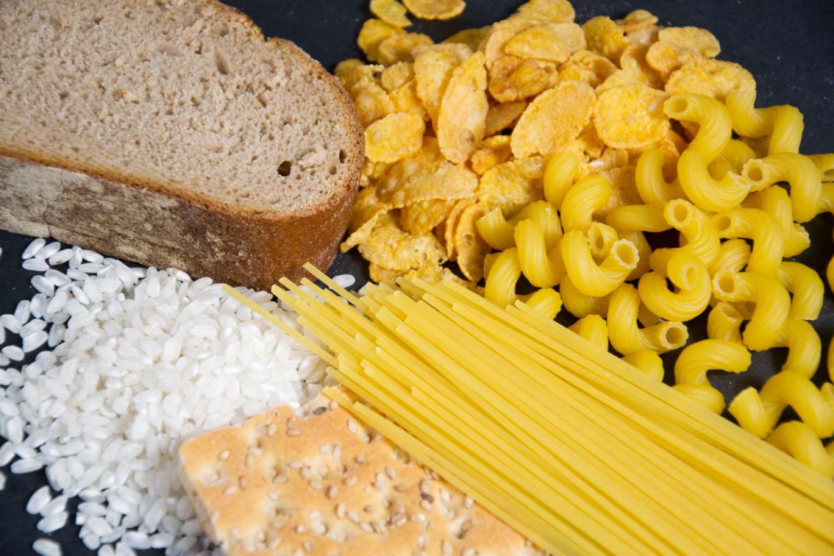 Examples of carbs including bread, cereal, pasta, and rice